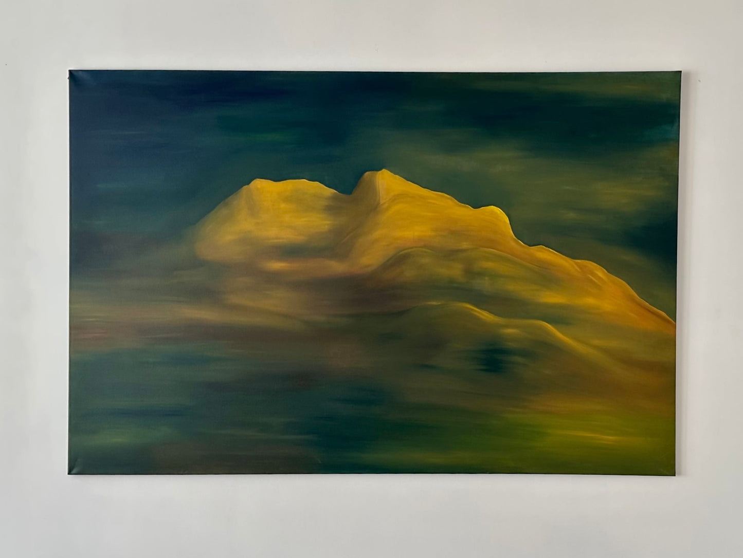 This image features a beautifully rendered oil on canvas painting titled "Mount Arrowsmith, Vancouver Island, under moonlight." The artwork captures the mountain range bathed in a soft moonlight glow, with shades of deep green and yellow highlighting the rugged contours and peaks.